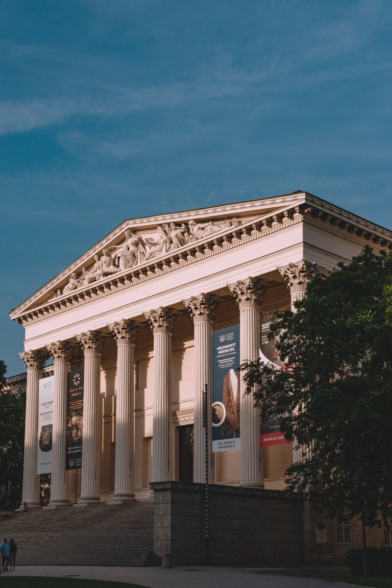 a building with columns and a sign