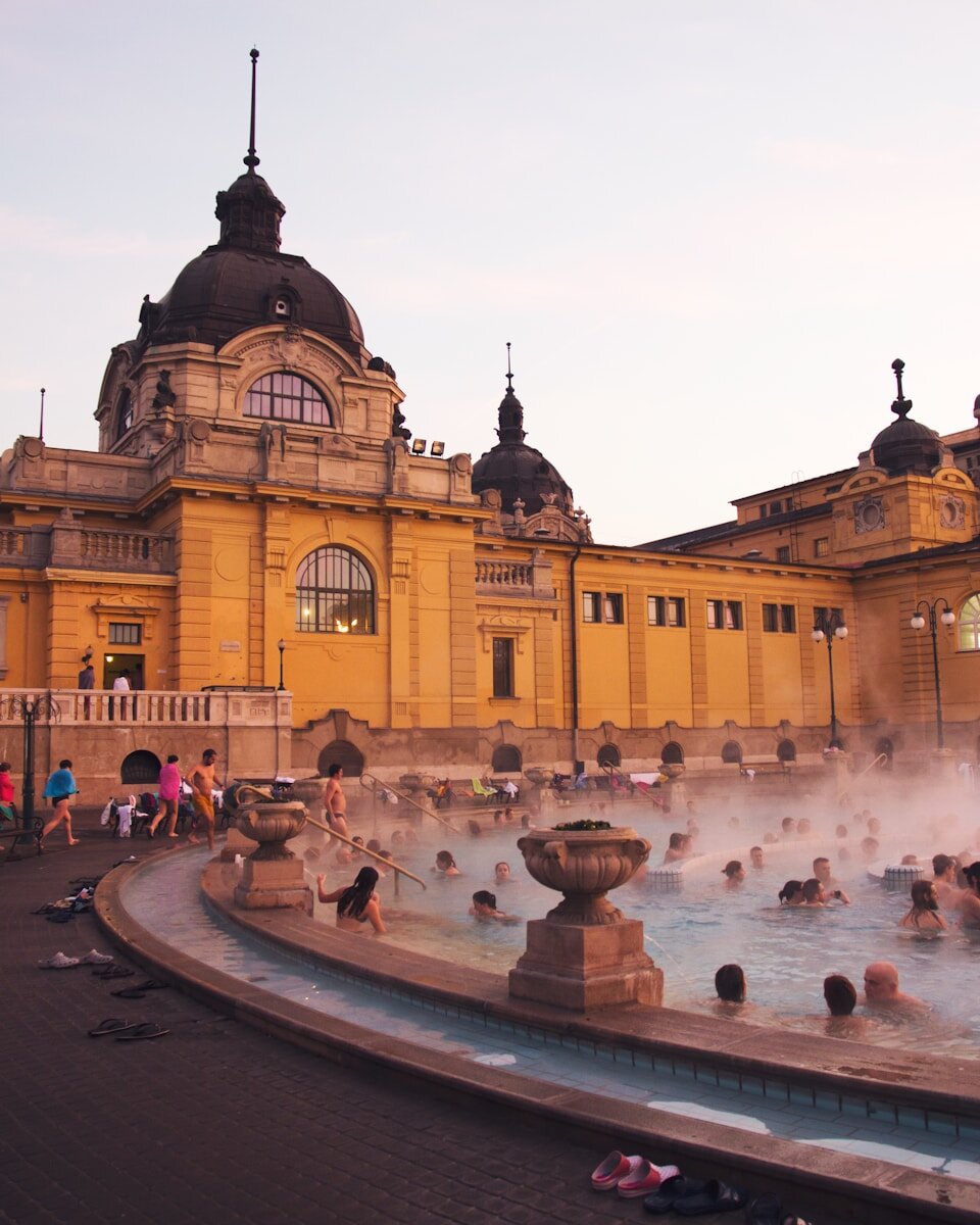 A large building with a fountain in front of it