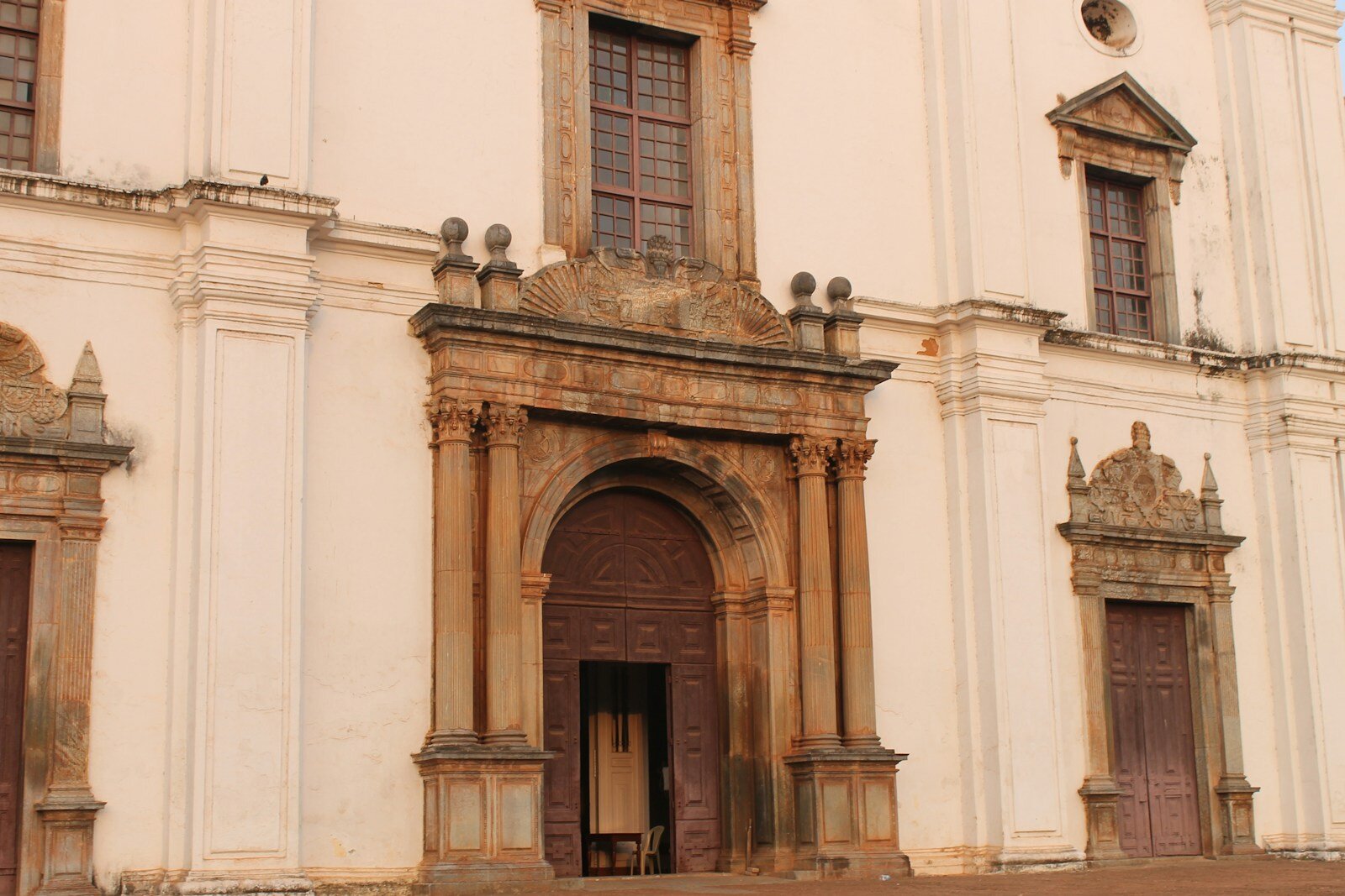 a large white building with a brown door